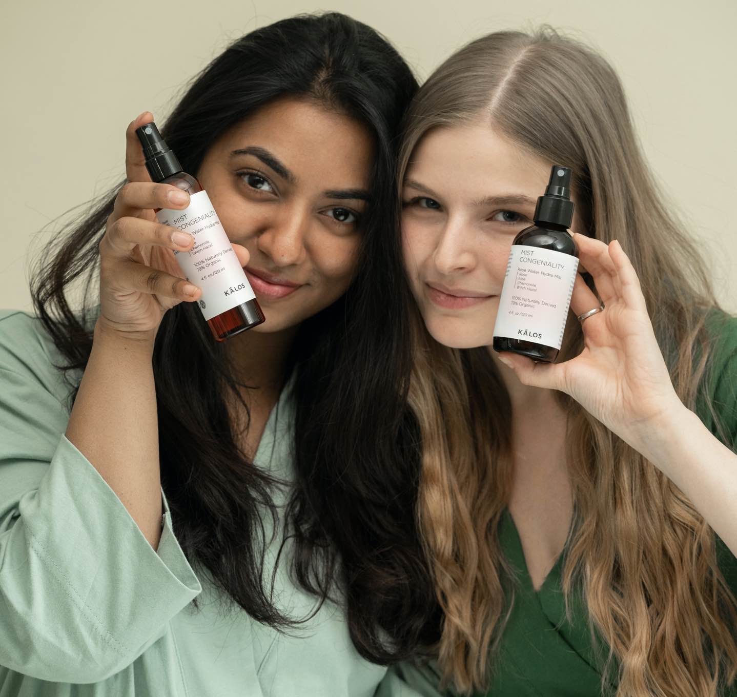 Women holding white labeled bottle