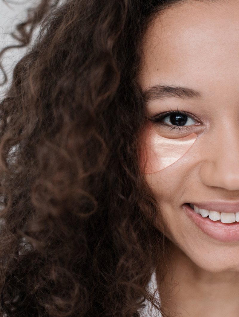 Woman smiling with eyemask